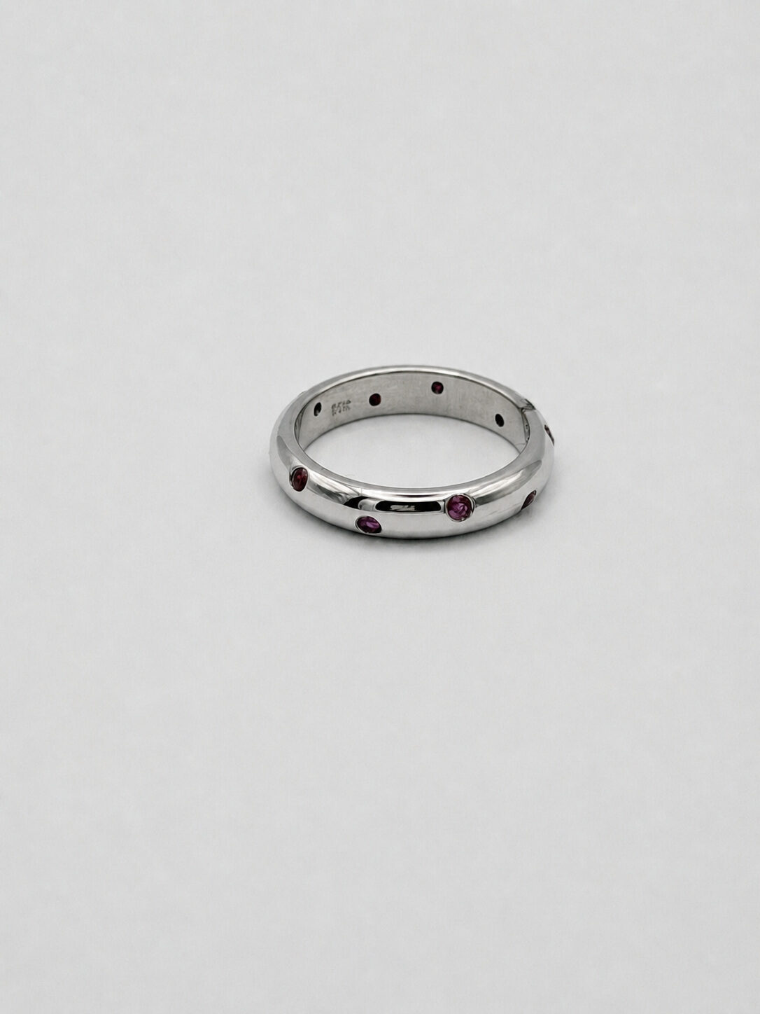14k White Gold Flush-Set Ruby Spaced Band — Size 7, reference J075, Pre-Owned — front view, for sale from a private Orange County watch dealer